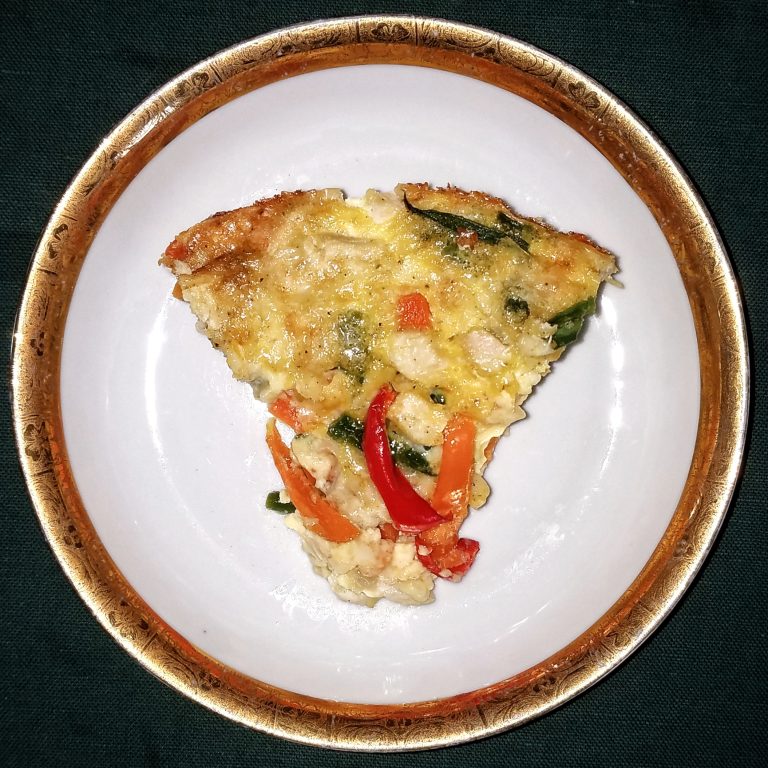 A slice of homemade quiche